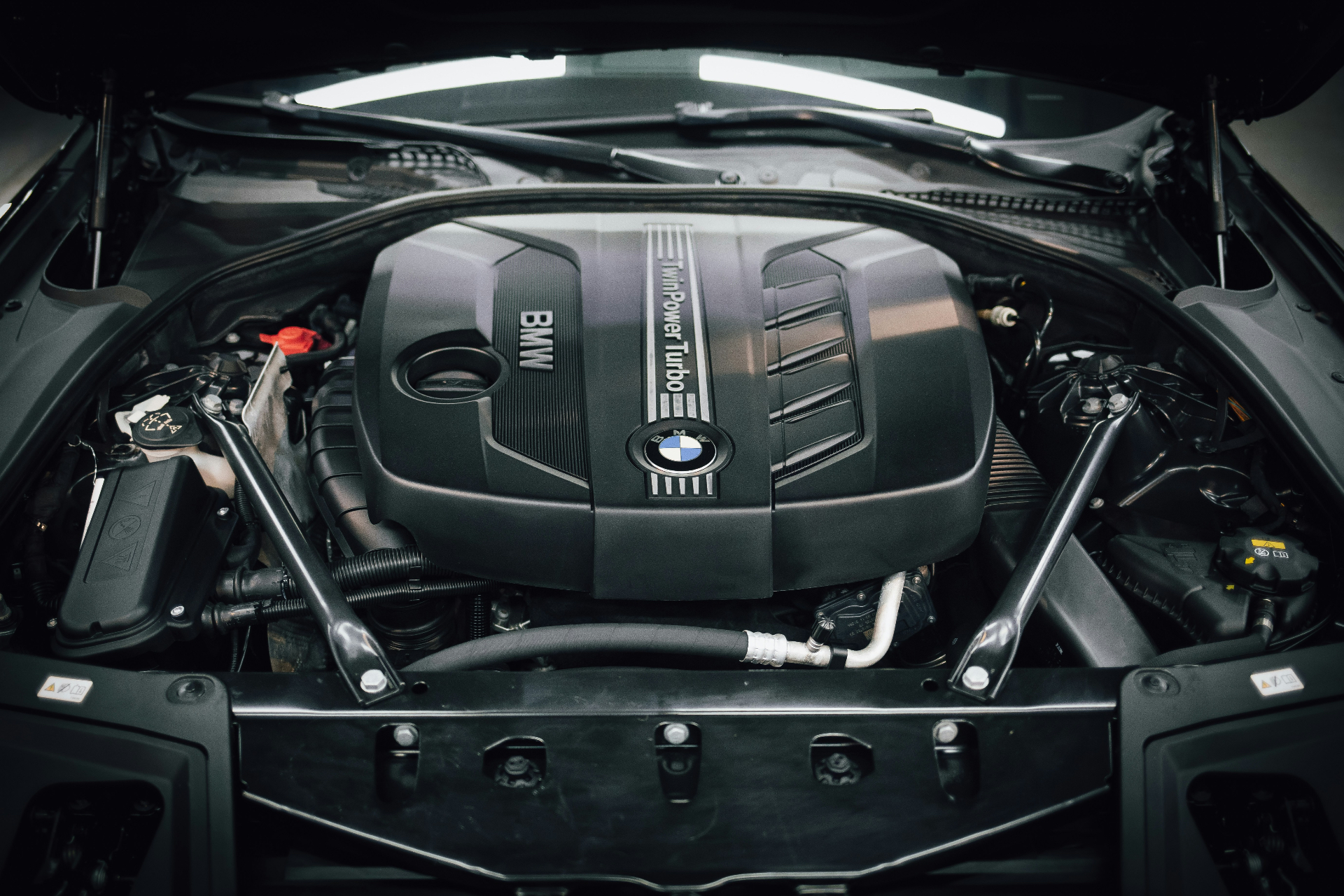 BMW engine bay under inspection